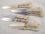 Appraisal: Eight silver handled table and nine dessert knives Queens pattern