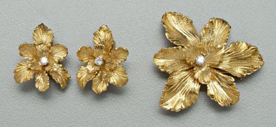 Appraisal: Gold and diamond jewelry suite floral form each set with