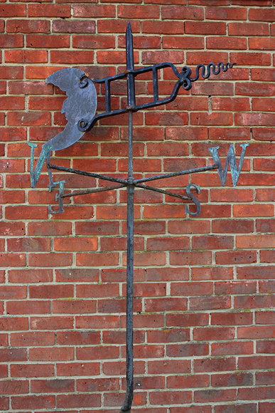 Appraisal: AN OLD BLACK PAINTED WROUGHT IRON WEATHER VANE the rotating