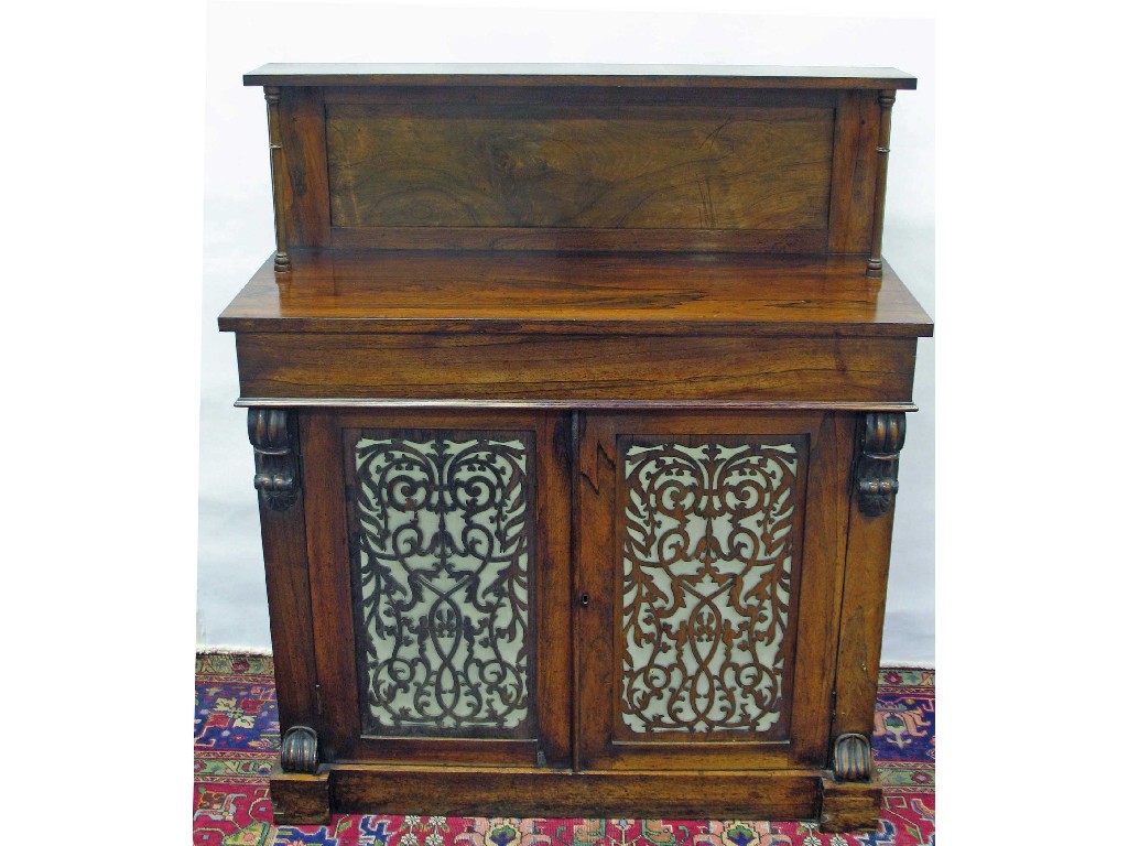 Appraisal: A Regency rosewood chiffonier with raised shelf and twin fretwork