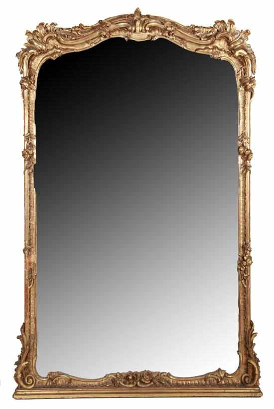 Appraisal: Rococo style giltwood overmantel mirror mid th century shaped and