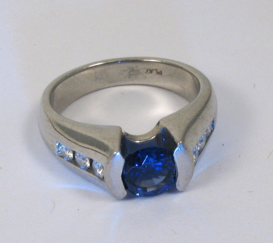 Appraisal: SAPPHIRE DIAMOND AND PLATINUM RING set with a round-cut violet