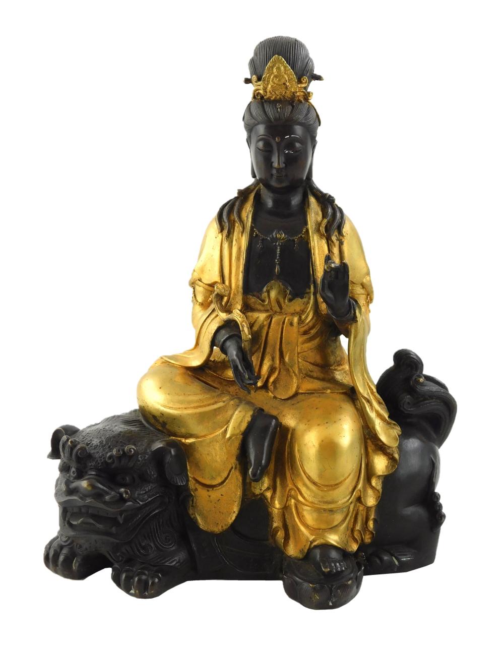 Appraisal: ASIAN PARCEL GILT BRONZE FIGURE OF GUANYIN SEATED ATOP A