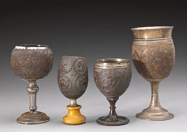 Appraisal: Four European silver mounted coconut cups th early th century