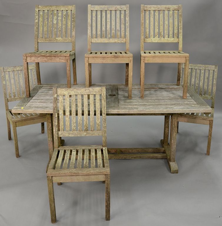 Appraisal: Seven piece Gloster teak outdoor set including six chairs and