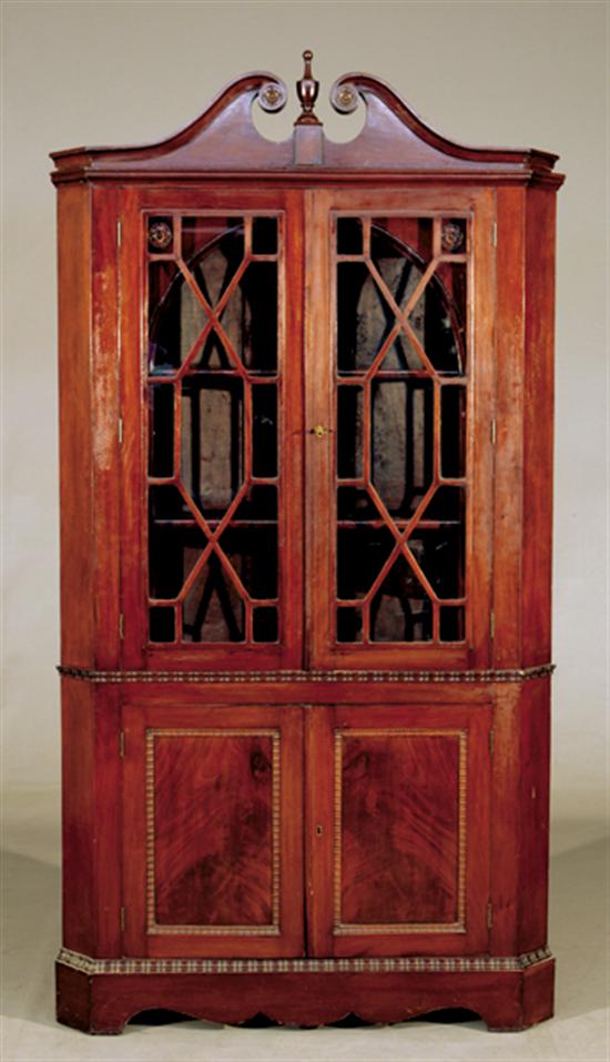 Appraisal: Georgian style carved mahogany corner cabinet late th centuryswan's-neck pediment