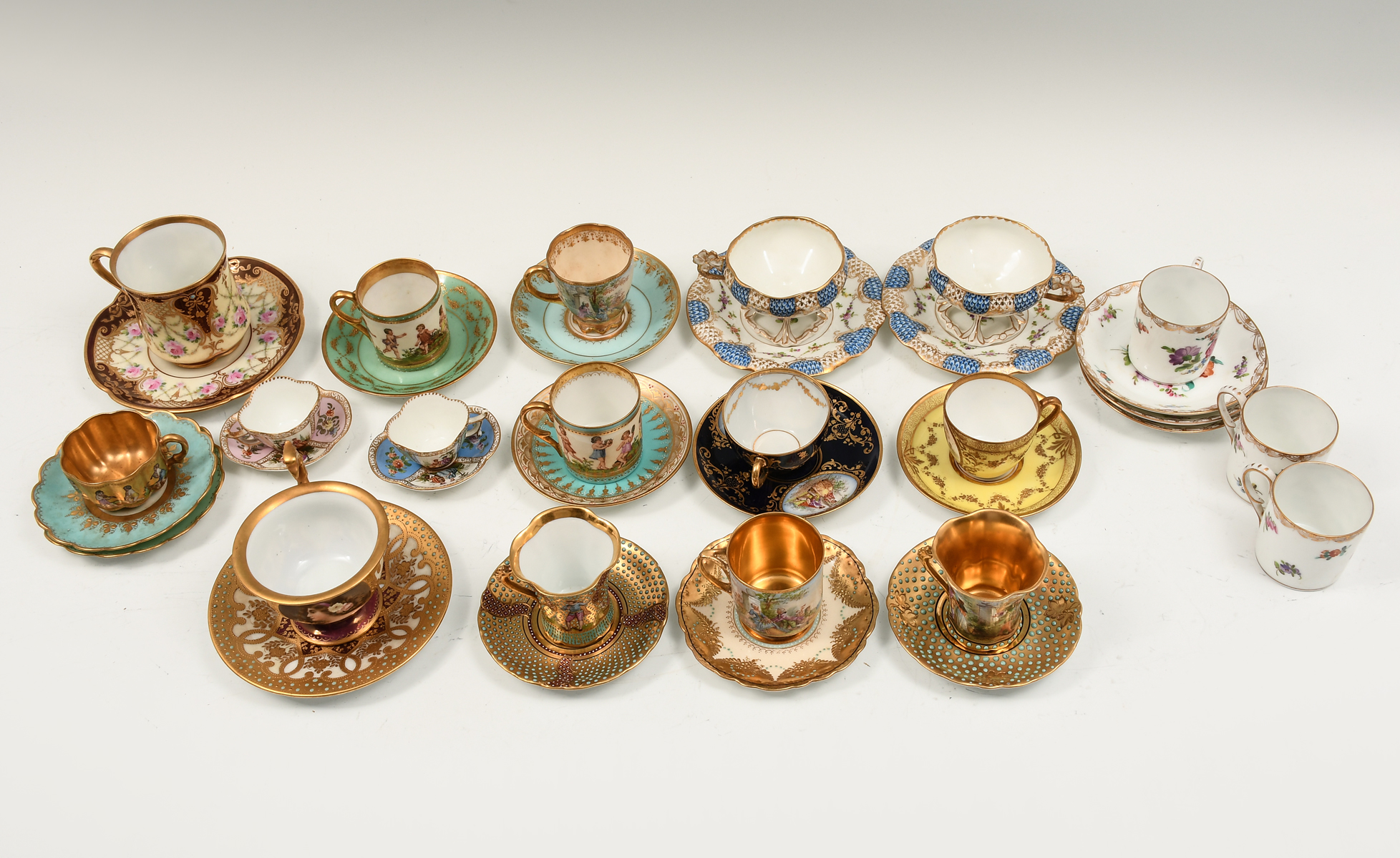 Appraisal: PC DRESDEN PORCELAIN TEACUPS SAUCERS A collection of sets of