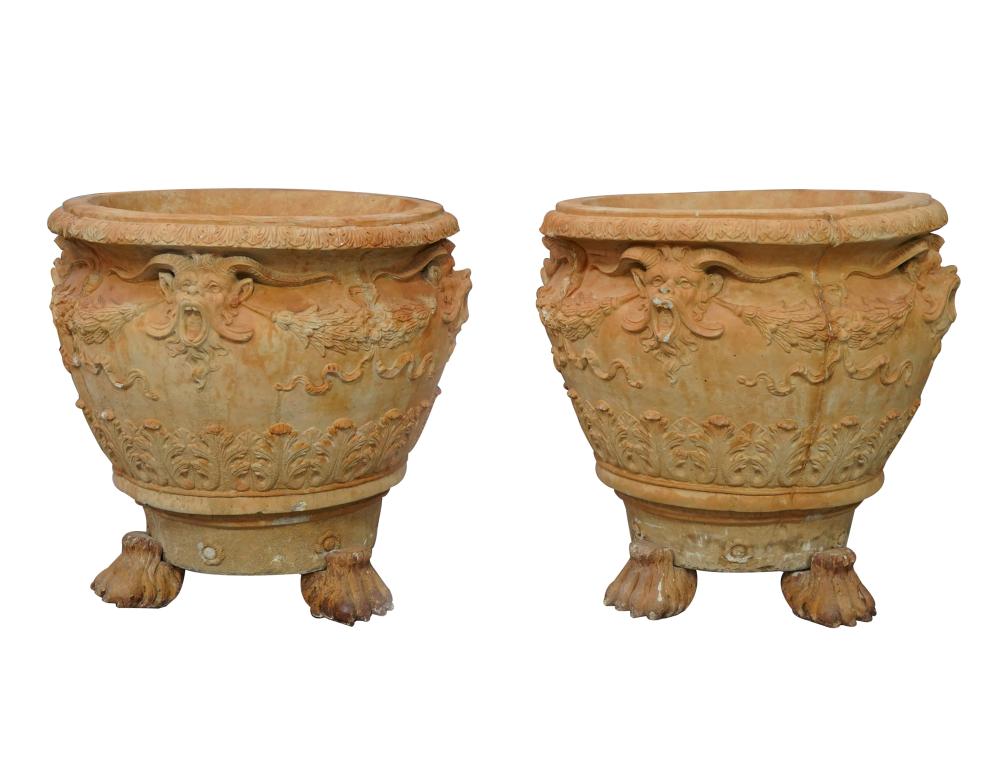 Appraisal: PAIR OF TERRACOTTA PLANTERSeach molded with satyr masks suspending ribbon-tied