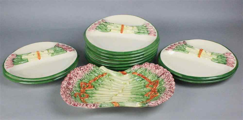 Appraisal: PORTUGESE ASPARAGUS SET molded with bunches of asparagus ten plates