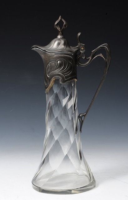 Appraisal: AN ART NOUVEAU GLASS AND PEWTER MOUNTED CLARET JUG of