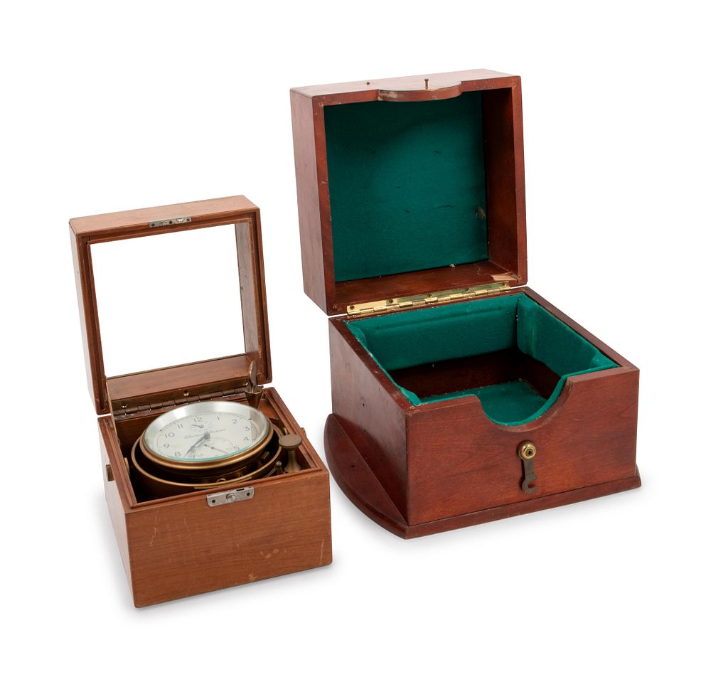 Appraisal: An English Mahogany Cased Three-Day Ship's Chronometer An English Mahogany