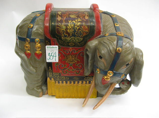 Appraisal: CHINESE CARVED WOOD ELEPHANT hand painted decoration in parade costume