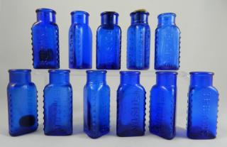 Appraisal: Poison bottles Poison- cobalt triangular three corners have knobs square