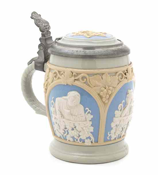 Appraisal: A German Mettlach Stein depicting men at tables of scrolling