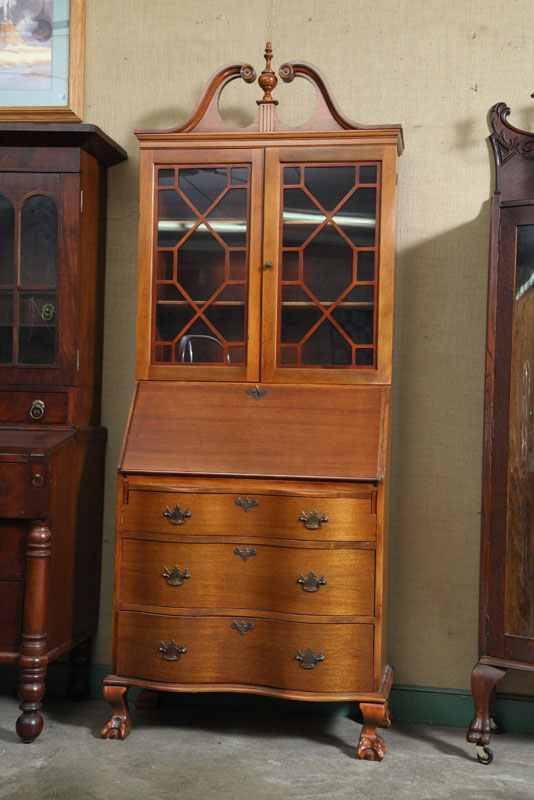 Appraisal: ONE PIECE SECRETARY BOOKCASE Mahogany having a broken arched pediment