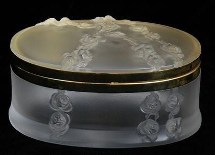 Appraisal: LALIQUE GILT-METAL-MOUNTED OVAL GLASS LIDDED BOX Incised Lalique France relief