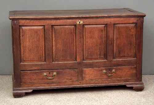 Appraisal: An th Century panelled oak mule chest fitted two drawers