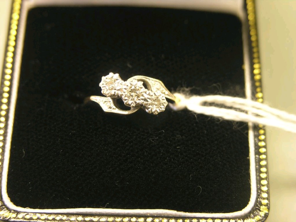 Appraisal: An ct gold platinum and three stone diamond ring interlaced