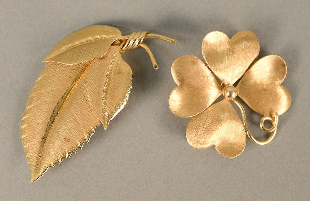 Appraisal: Two karat gold pins flower and leaf lg in dia