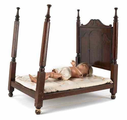 Appraisal: Victorian walnut doll bed th c h w together with