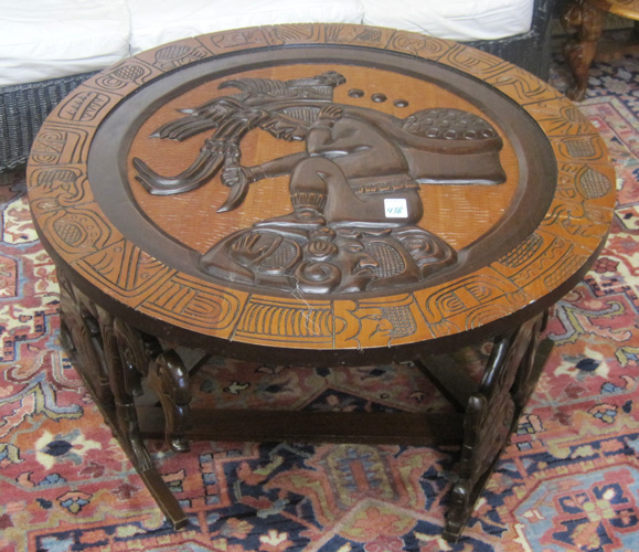 Appraisal: ROUND MAYAN STYLE RELIEF-CARVED COFFEE TABLE the round top featuring