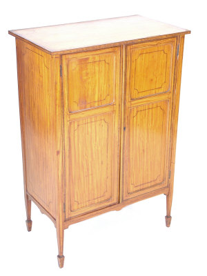 Appraisal: An Edwardian Sheraton style satinwood side cabinet of rectangular form