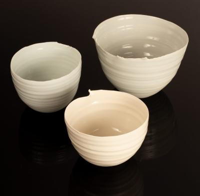 Appraisal: Carina Ciscato born three porcelain bowls two with pale blue