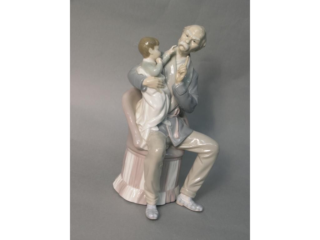 Appraisal: A large Lladro figure group seated grandfather with child in