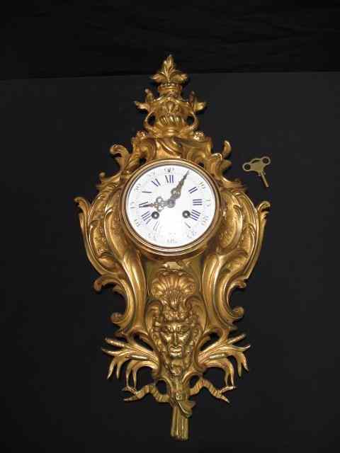 Appraisal: Gilt metal bronze rococo cartel style wall clock Enamel face