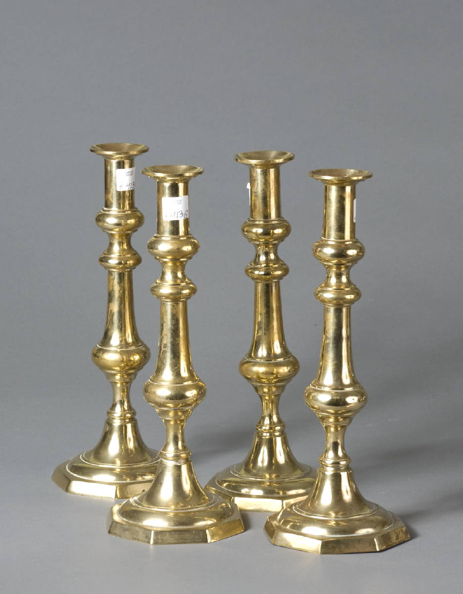 Appraisal: SET OF FOUR BRASS BALUSTER-FORM CANDLESTICKS WITH OCTAGONAL BASES Height