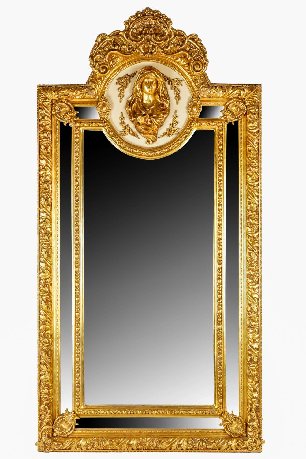 Appraisal: FRENCH CARVED GILT WOOD WALL MIRRORsurmounted by a relief-carved female