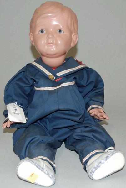 Appraisal: Celluloid Baby in Blue Sailor Outfit Celluloid head and extremities