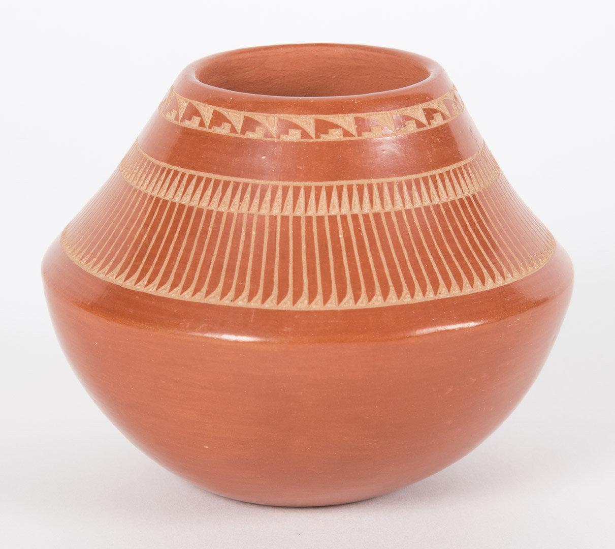 Appraisal: Marie Gonzales San Ildefonso redware pot with etched feather decoration