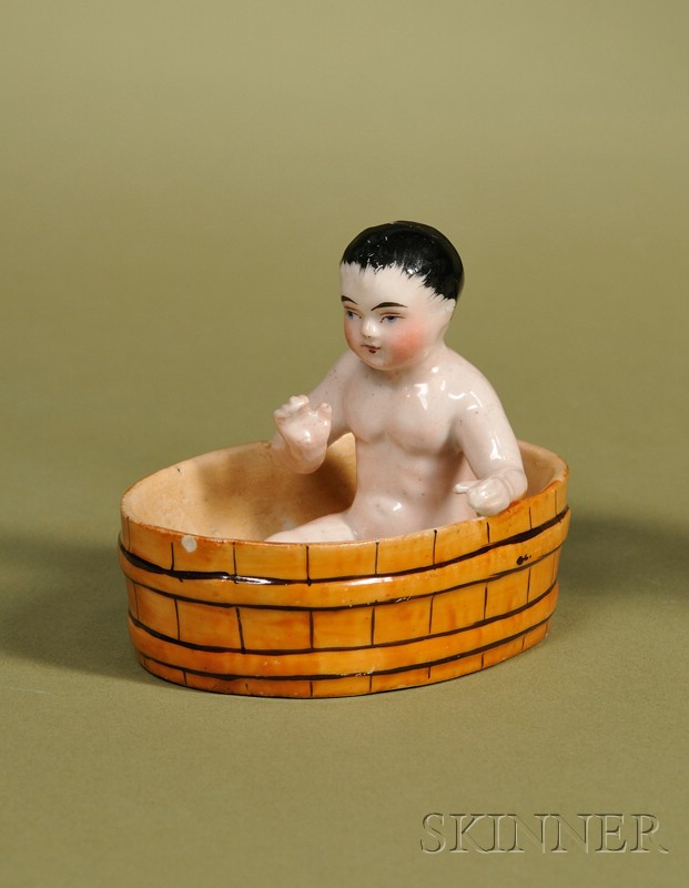 Appraisal: China Frozen Charlie in Tub Germany c glazed porcelain seated