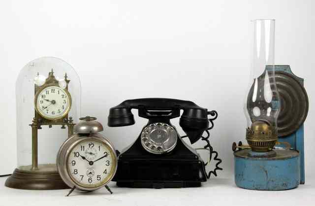 Appraisal: A GPO black telephone an anniversary clock an oil lamp