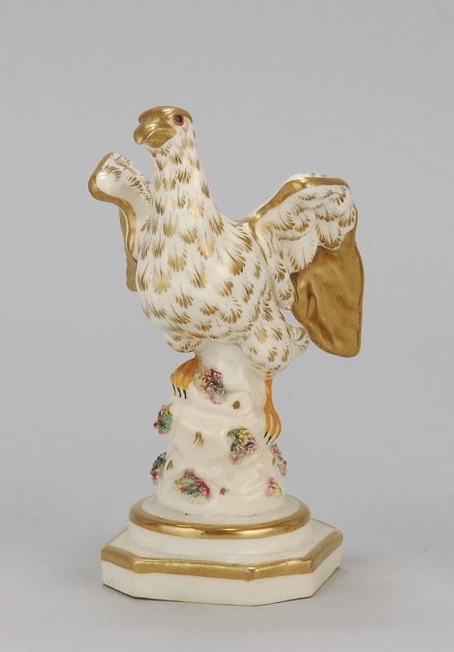 Appraisal: STAFFORDSHIRE EAGLE Circa With gold decoration and orange talons on