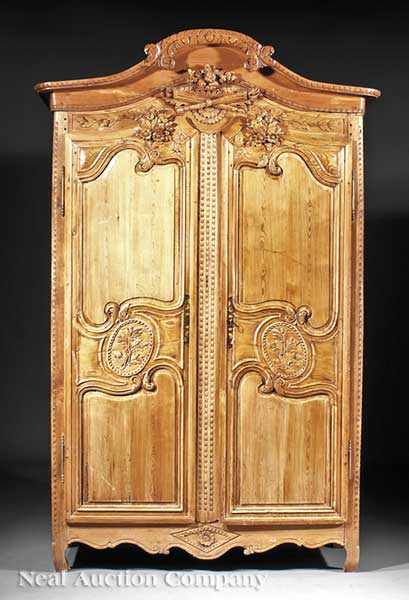 Appraisal: A French Provincial Carved Pine Armoire probably early th c