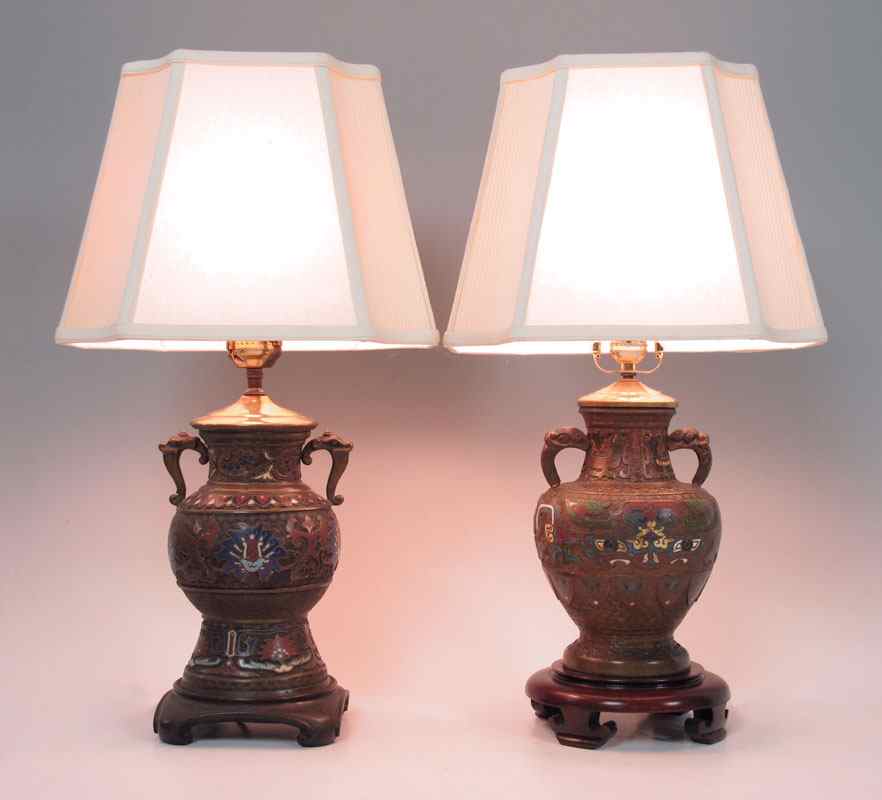 Appraisal: PAIR CHAMPLEVE LAMPS Champleve metal and carved wood bases Bases