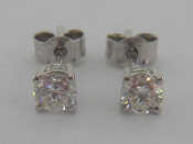 Appraisal: A pair of single stone diamond ear studs each brilliant