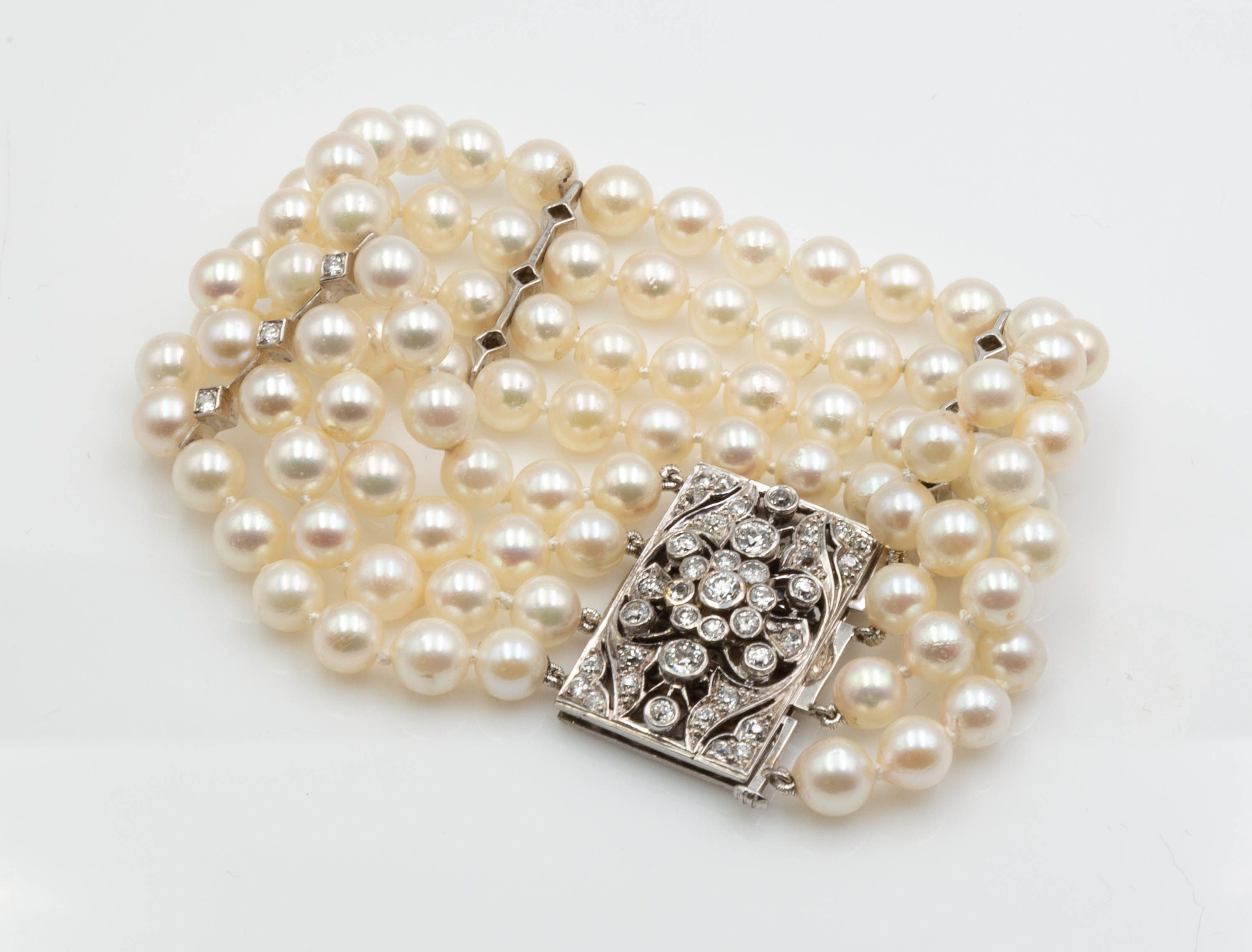 Appraisal: FOUR STRAND PEARL BRACELET WITH K GOLD AND DIAMOND CLASP