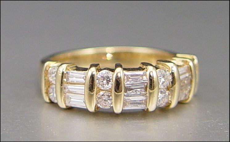 Appraisal: CTW DIAMOND BAND RING K yellow gold band contains eight