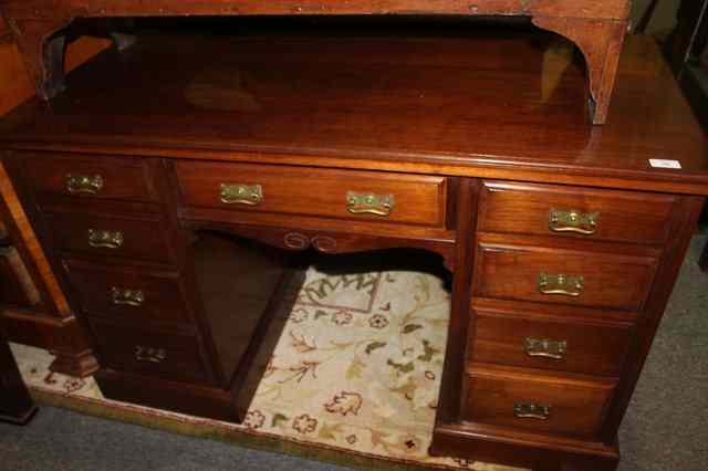 Appraisal: A VICTORIAN WALNUT PEDESTAL DESK fitted nine drawers on a