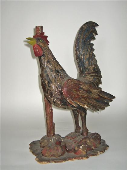 Appraisal: Carved and painted roosterThe figure of a crowing rooster on