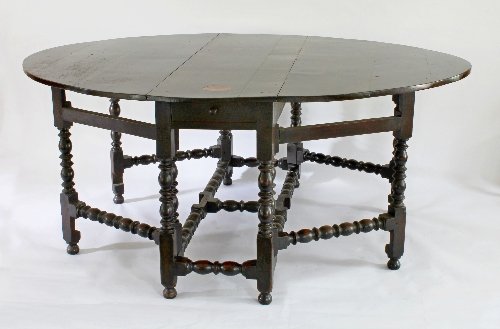 Appraisal: A th Century oak gateleg table with oval two-flap top