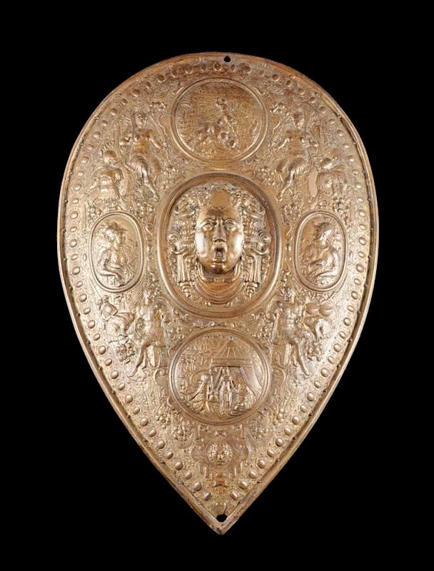 Appraisal: A CAST IRON SHIELD AFTER BENVENUTO CELLINI'S PARADE SHIELD OF