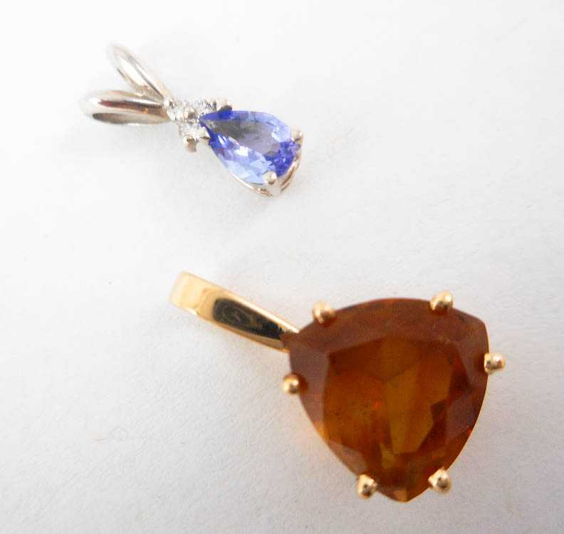 Appraisal: TWO GEMSTONE AND FOURTEEN KARAT GOLD PENDANTS including a k