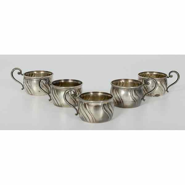 Appraisal: German Silver Cups German Five sterling silver handled-cups each with