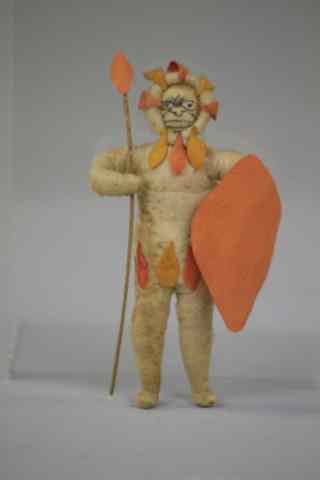 Appraisal: ZULU WARRIOR PRESSED COTTON ORNAMENT Germany fierce Zulu warrior with