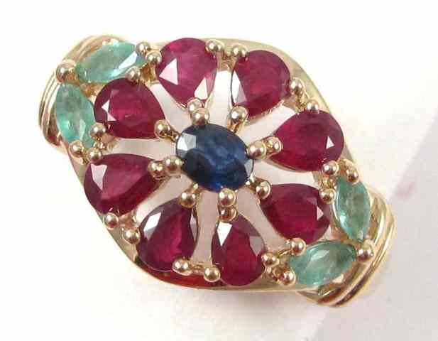 Appraisal: SAPPHIRE RUBY AND EMERALD RING k yellow gold with an