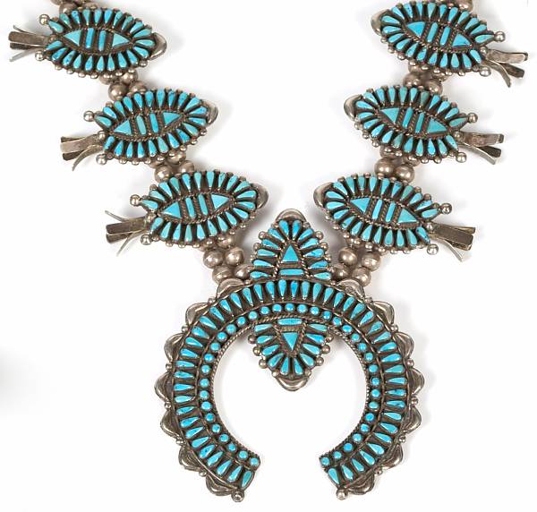 Appraisal: A turquoise and silver squash blossom necklace with a turquoise